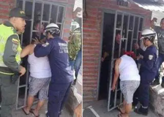 Mulher fica com cabeça presa no portão ao tentar espiar a casa vizinha